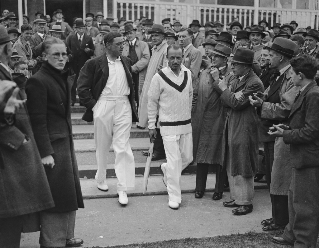 1st June 1938: English cricketer Walter 'Wally' Hammond (1903 - 1965) and Australian cricketer Sir Don Bradman (1908 - 2001) going on for the toss in the first England v Australia test match at Trent Bridge, Nottingham, England. Sir Donald Bradman was the first cricketer to be knighted in 1949 for his services to cricket. (Photo by Central Press/Getty Images)